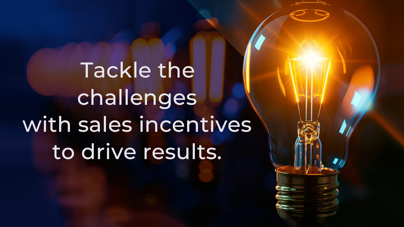 Close-up of an illuminated light bulb on the right with a glowing filament. On the left, white text reads, Tackle the challenges with sales incentives to drive results. The background is dark with soft, abstract bokeh lights.