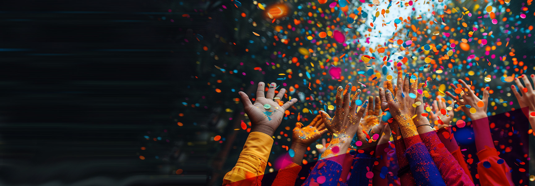 A group of hands reaching up towards a burst of colorful confetti against a dark background, creating a festive and joyful atmosphere.