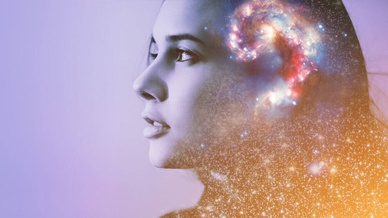 A profile of a womans face blends into a colorful galaxy swirl within her head, symbolizing imagination or a cosmic mind. The background is a gradient of purple to orange, enhancing the celestial theme.